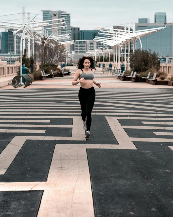Woman feeling energetic and vibrant during a light cardio exercise.